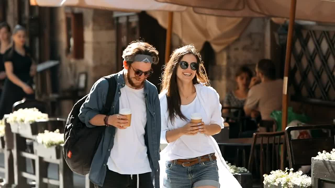 Stock Video Couple Enjoy Friendship While Walking On City Street Live Wallpaper For PC