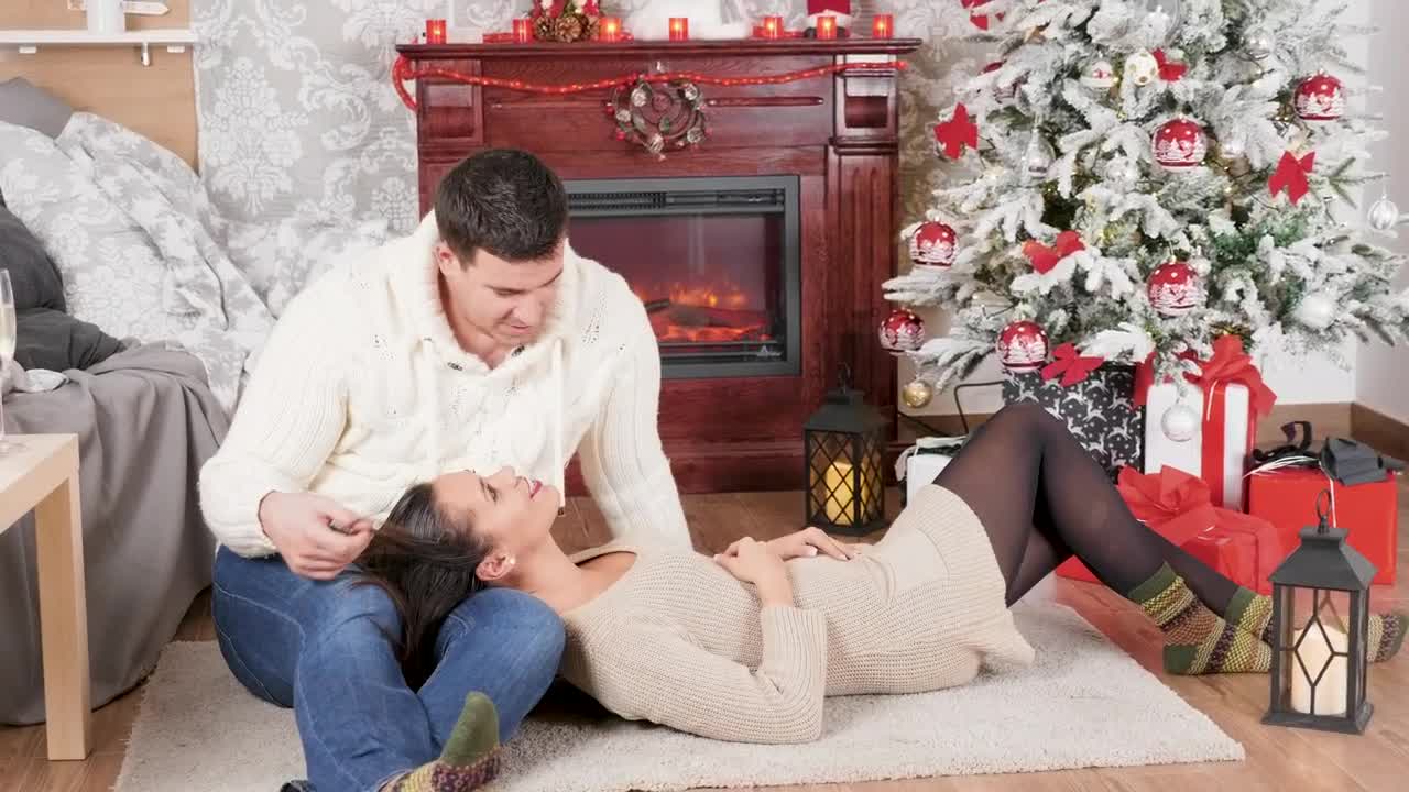 Stock Video Couple Enjoy Christmas Romance In Front Of Fireplace Live Wallpaper For PC