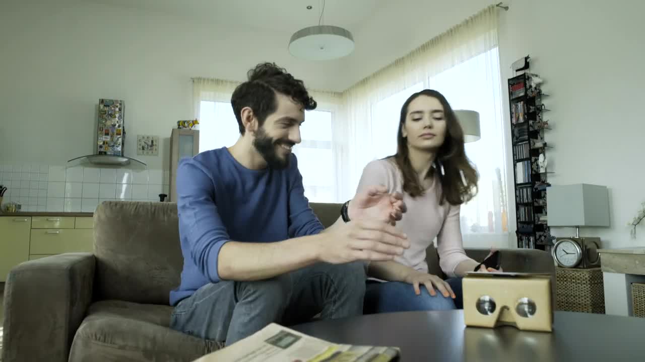 Stock Video Couple Assemble Cardboard Lenses For Virtual Reality Live Wallpaper For PC