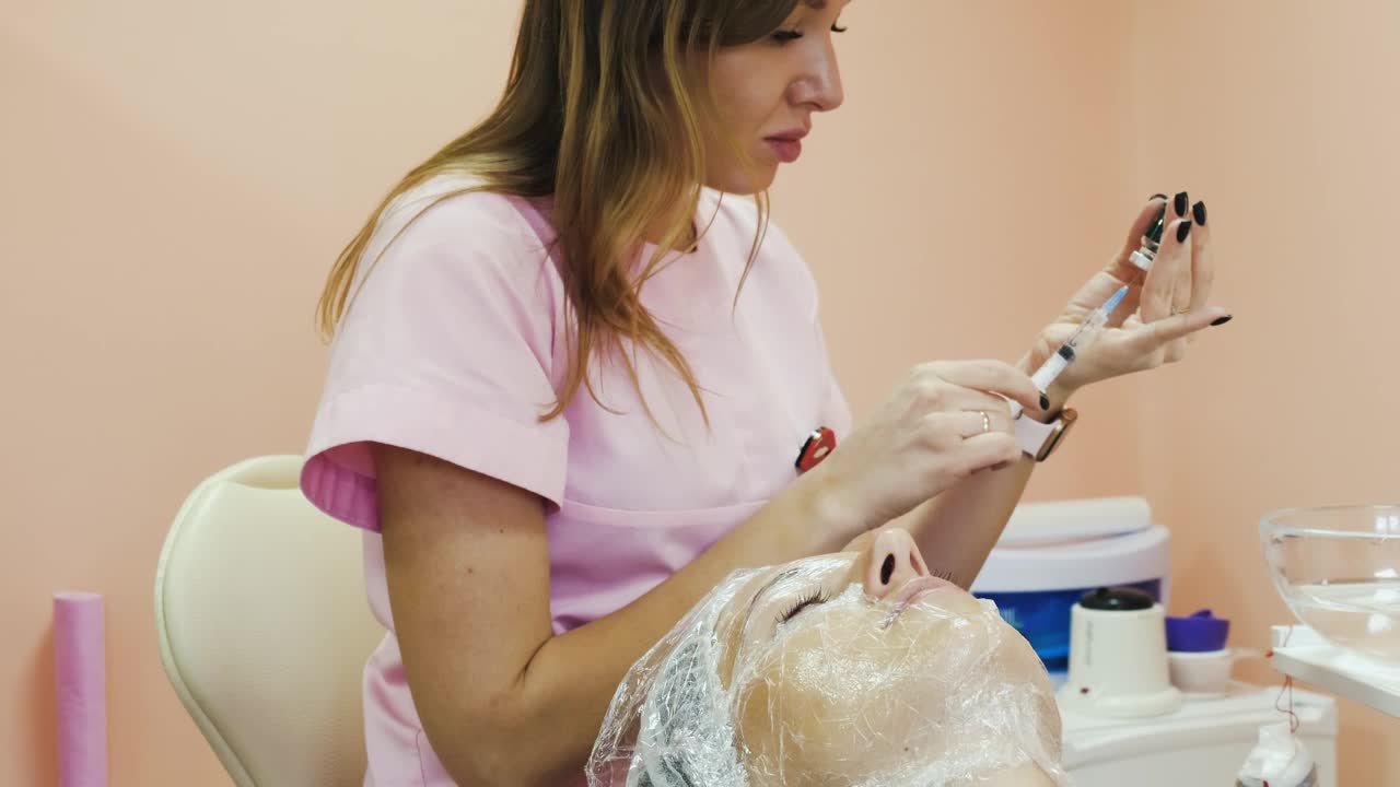 Stock Video Cosmetician Picking Up Medication Into Syringe Live Wallpaper For PC