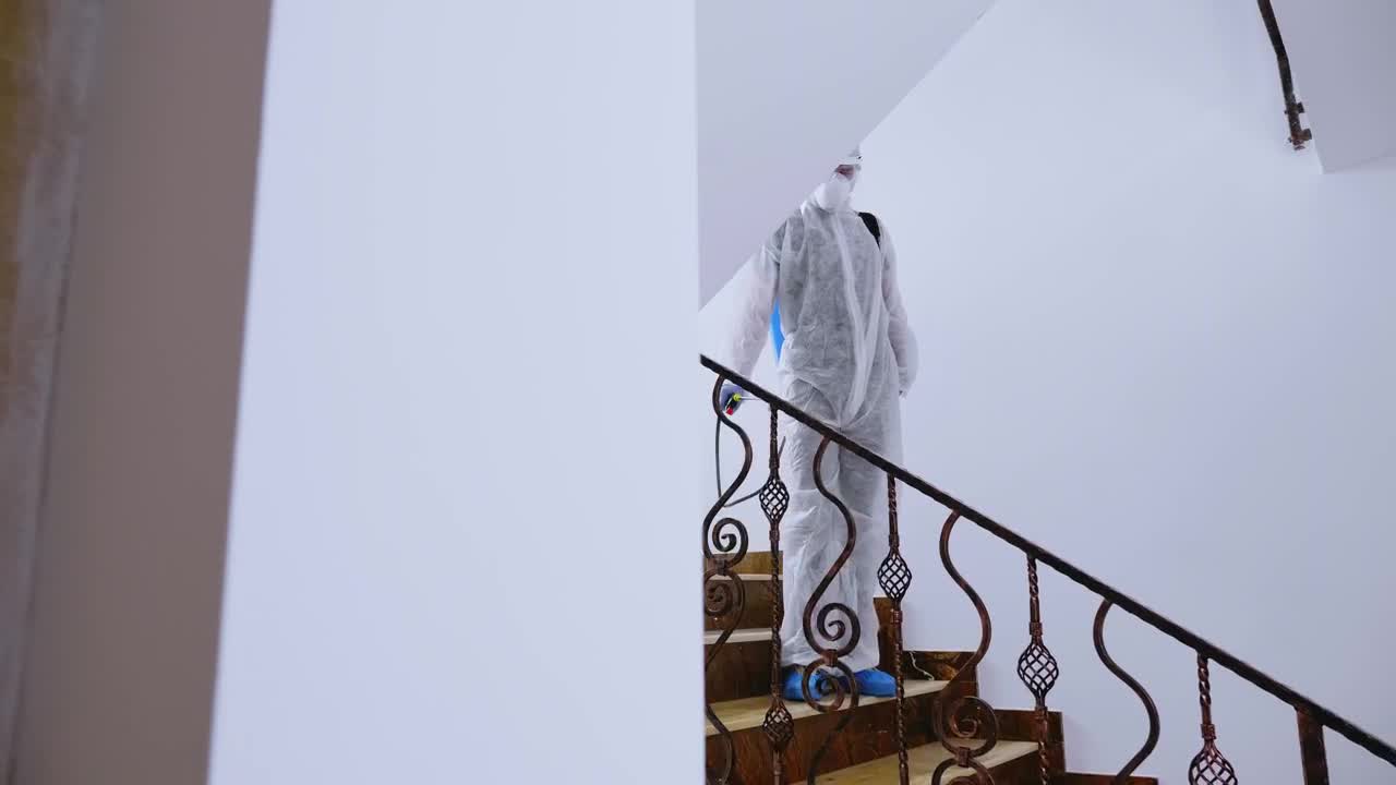 Stock Video Coronavirus Sanitization Of Hand Rail In Hazmat Suit Live Wallpaper For PC