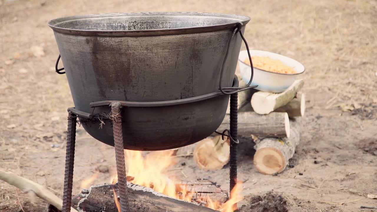 Stock Video Cooking Outdoors With A Cauldron In The Campfire Live Wallpaper For PC