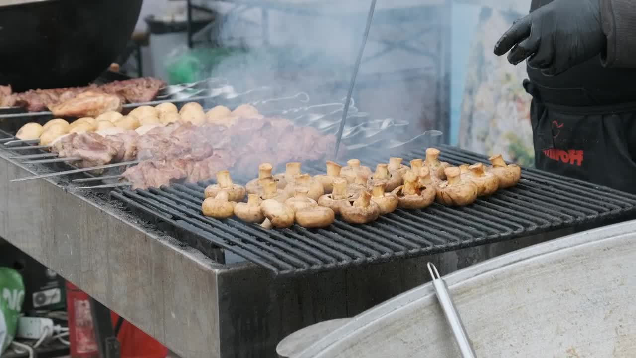 Stock Video Cook Preparing Meat And Mushrooms On The Grill Live Wallpaper For PC