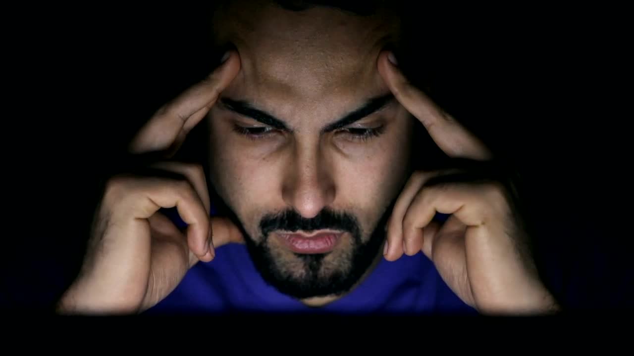 Stock Video Confused Man In Dark Room Stares At Laptop Screen Live Wallpaper For PC