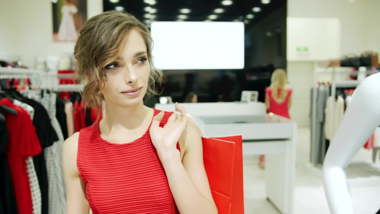 Stock Video Confident Woman Walks Through A Clothing Store Live Wallpaper For PC