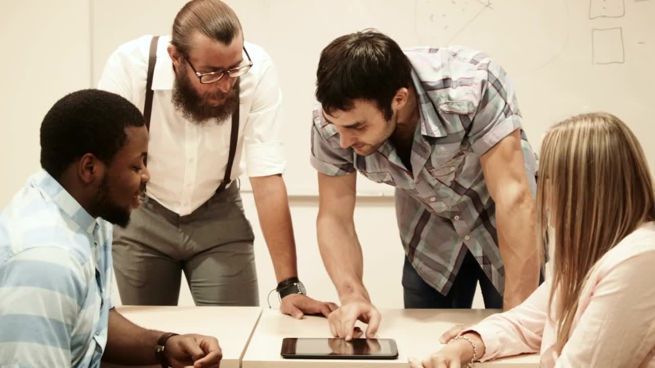 Stock Video College Team Checking Information On A Tablet Live Wallpaper For PC