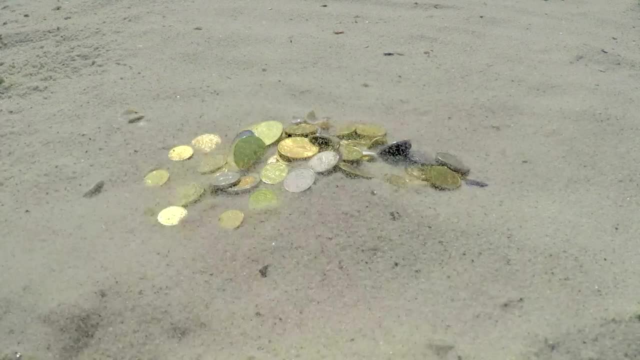 Stock Video Coins Buried In The Sand Live Wallpaper For PC