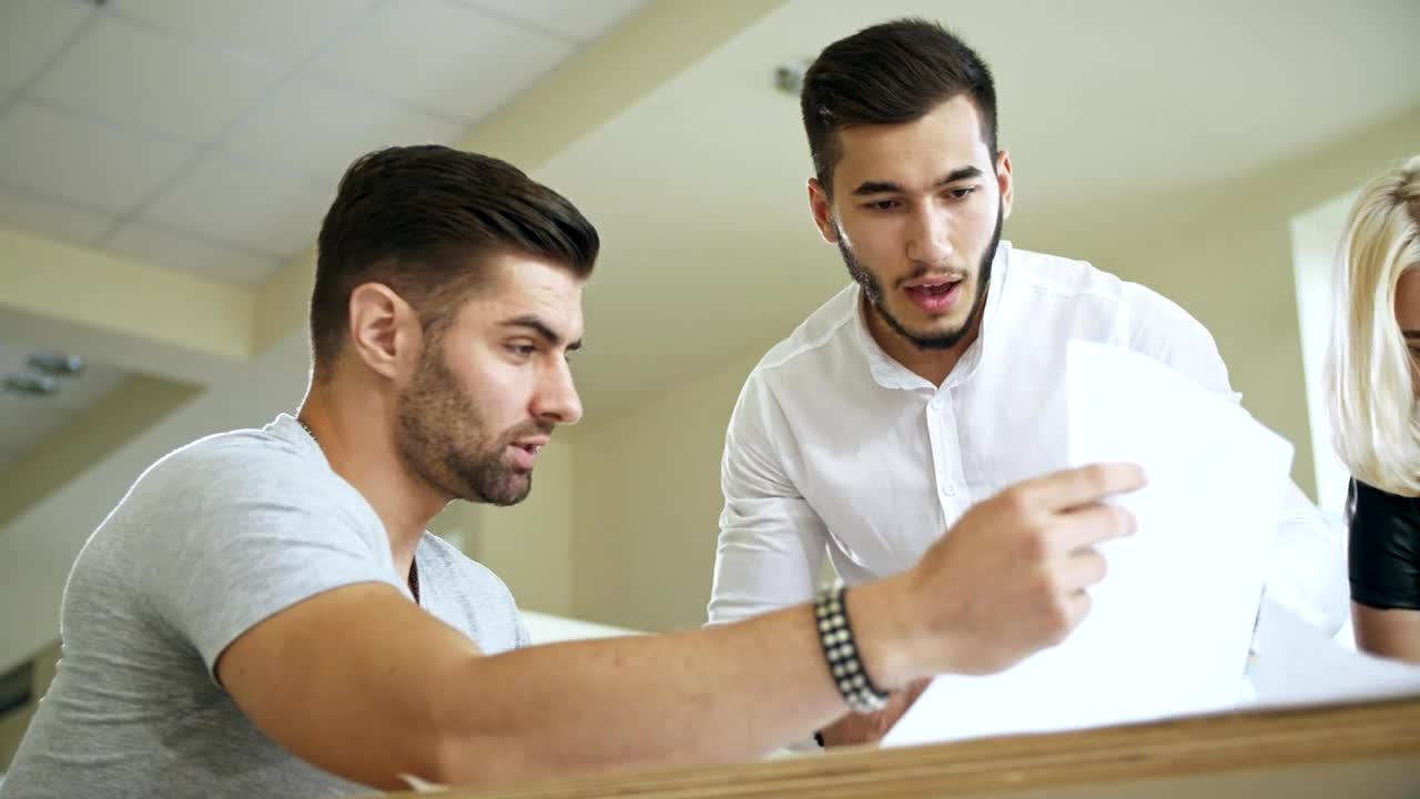 Stock Video Co Workers Reviewing A Document Live Wallpaper For PC