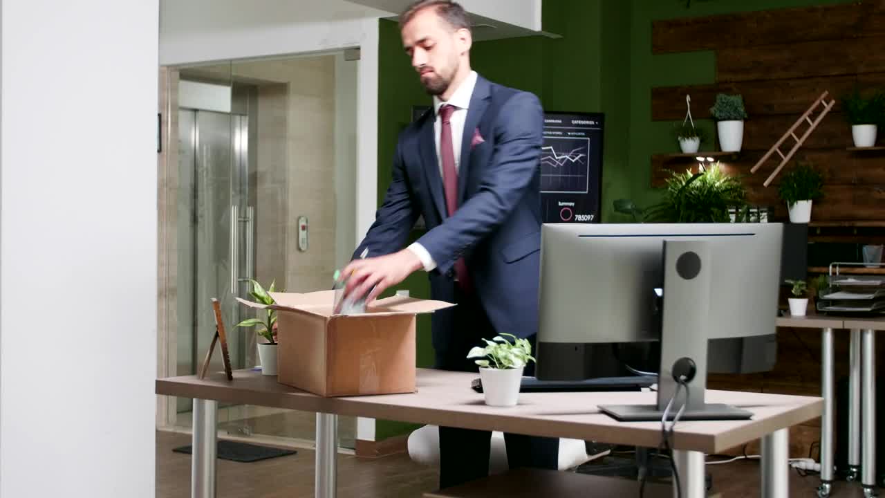 Stock Video Failed Man Cleans Out Desk After Losing Job Live Wallpaper For PC