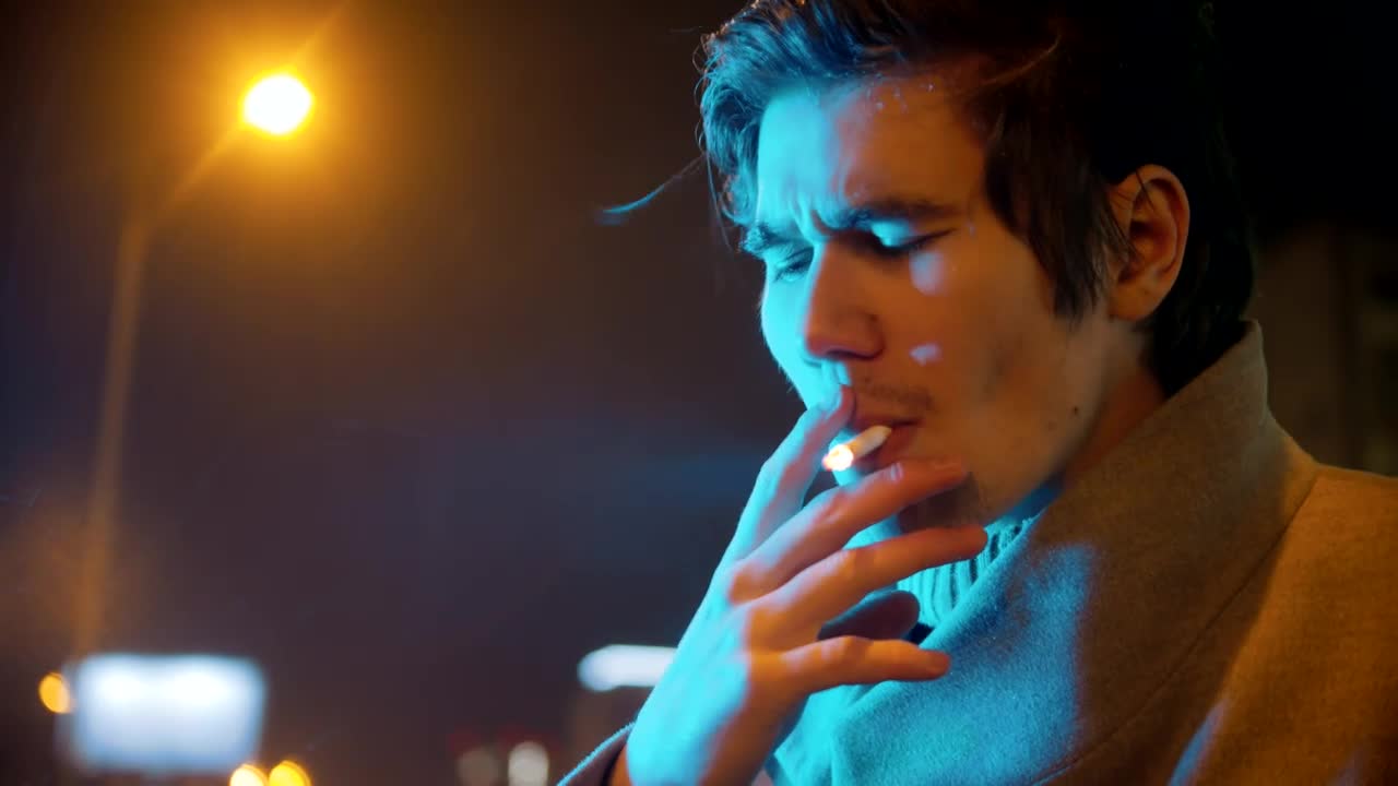 Stock Video Face Of A Young Man Smoking On A Rainy Night Live Wallpaper For PC