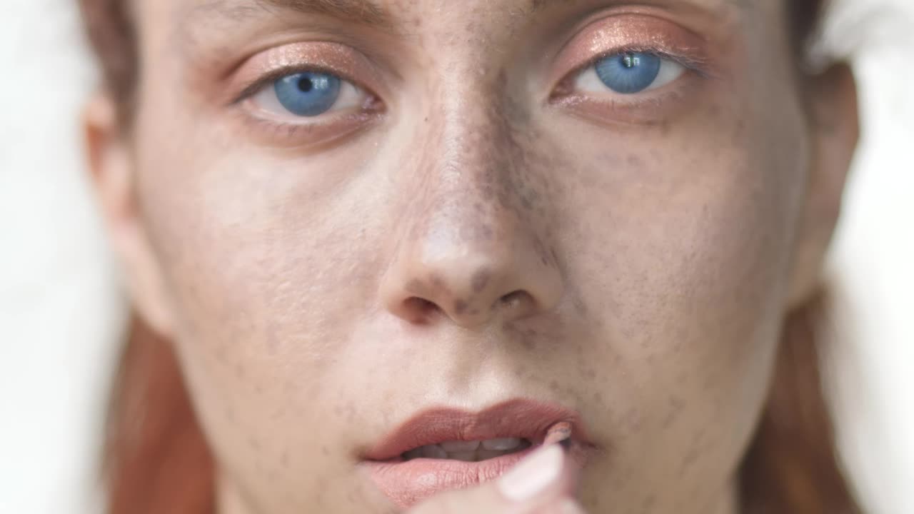 Stock Video Face Of A Woman Putting On Lip Makeup Live Wallpaper For PC