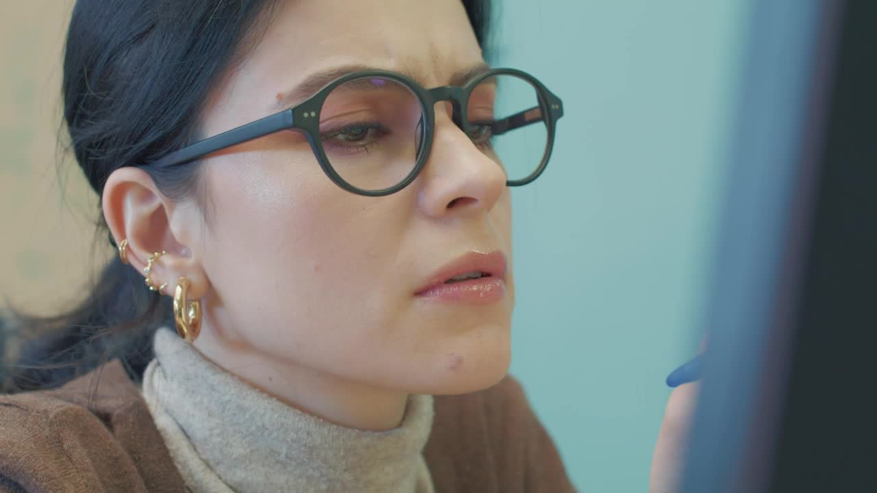 Stock Video Face Of A Woman Concentrating On Her Work Live Wallpaper For PC