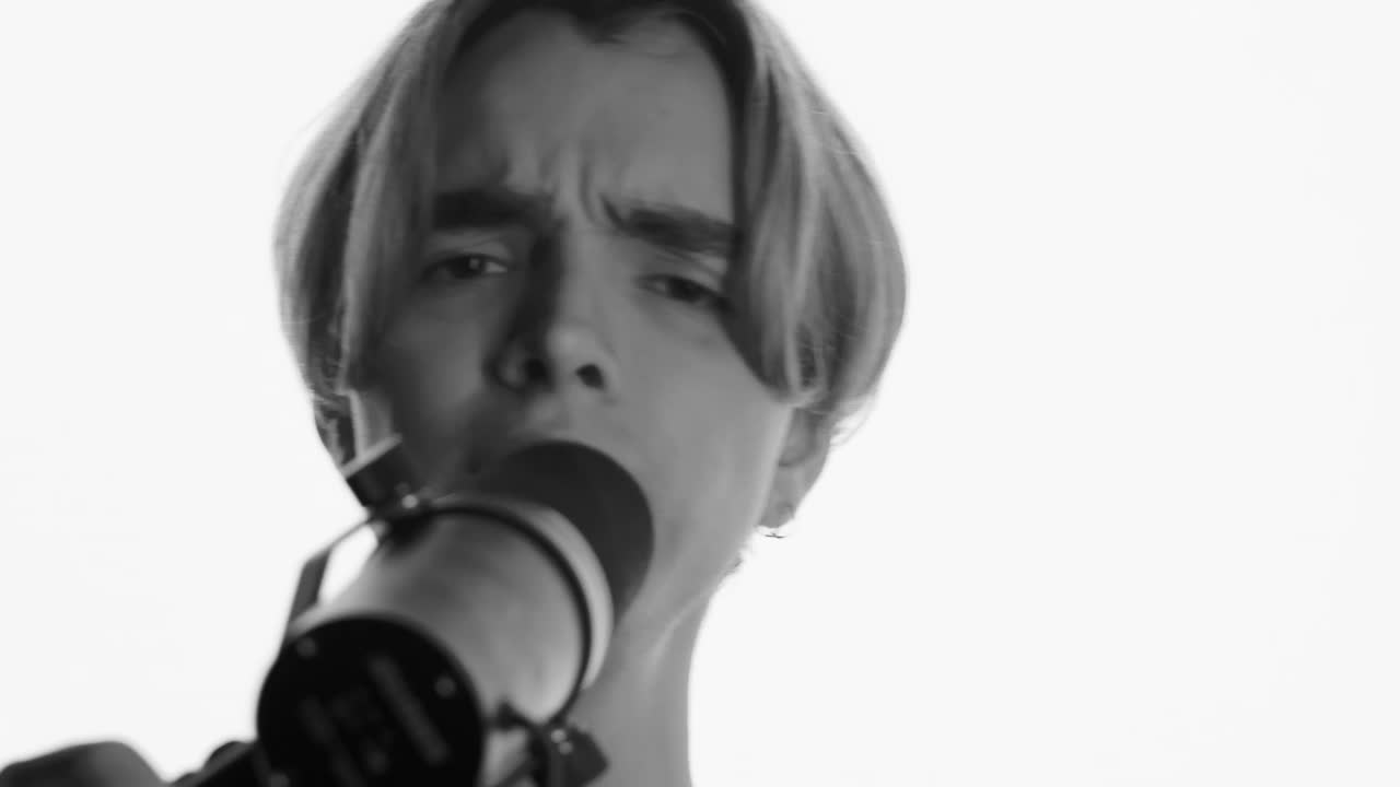 Stock Video Face Of A Man Singing In Front Of A Microphone Live Wallpaper For PC