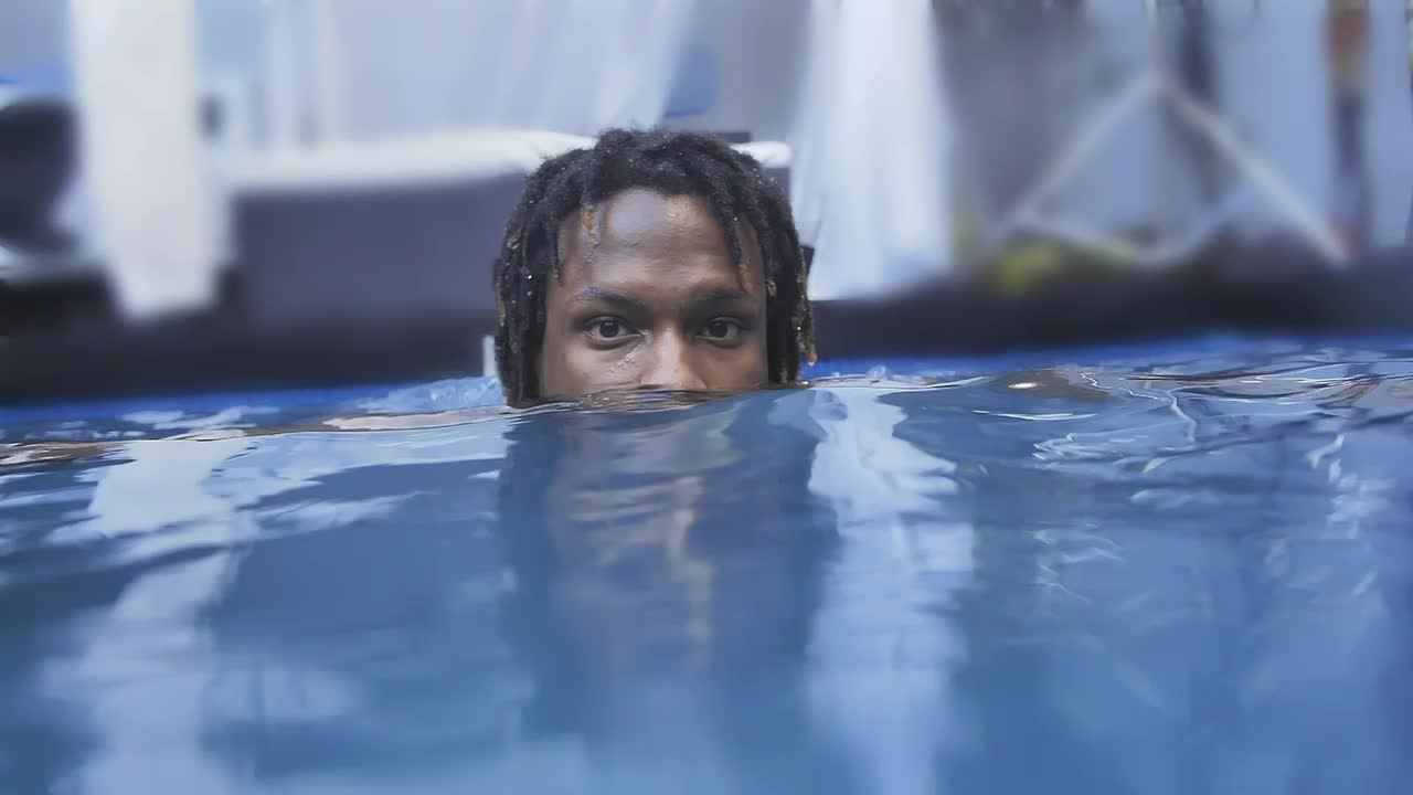 Stock Video Face Of A Man Leaning Out While He Floats On Live Wallpaper For PC