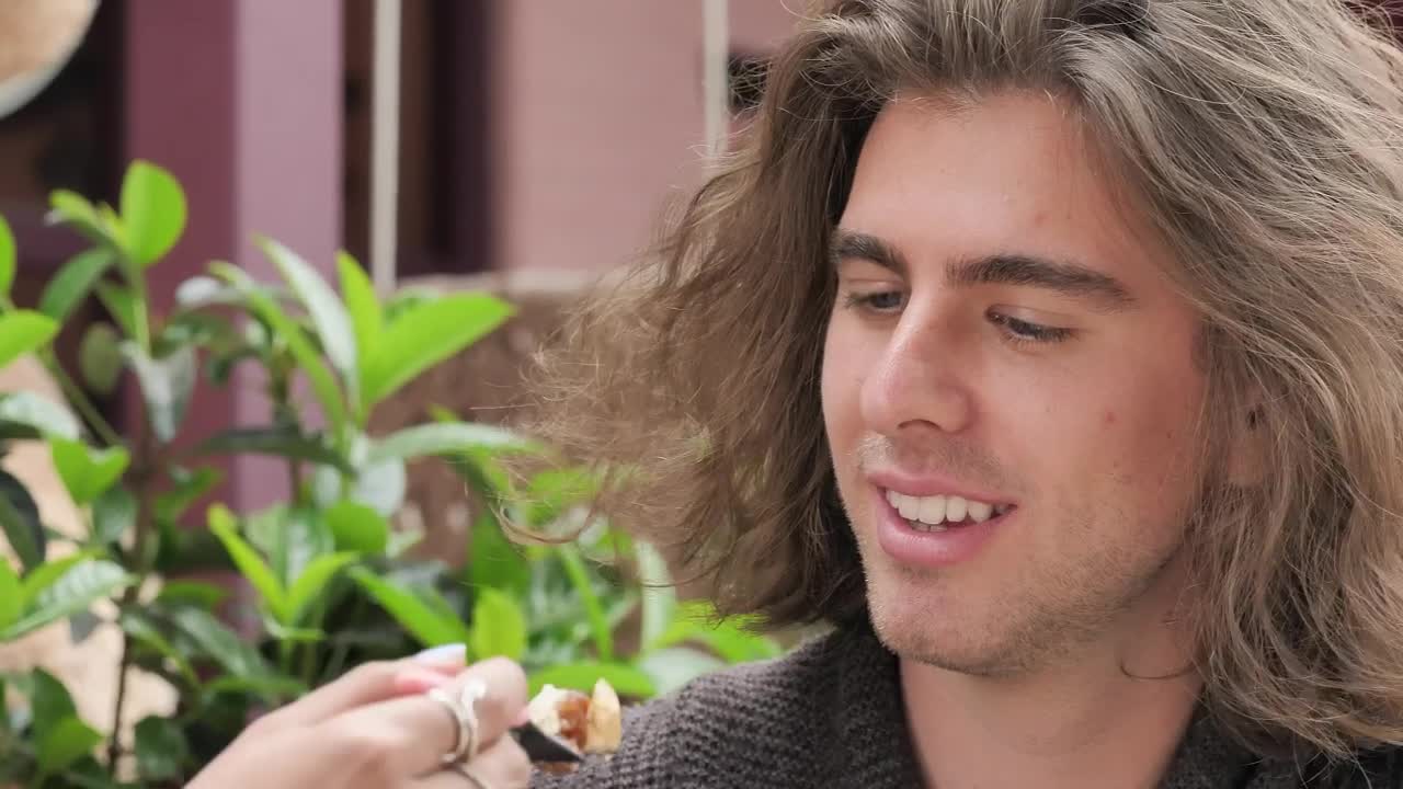 Stock Video Face Of A Man Eating And Joking With His Girlfriend Live Wallpaper For PC
