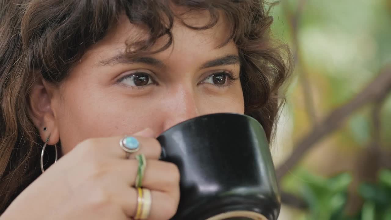 Stock Video Face Of A Girl Drinking Coffee While She Listens To Live Wallpaper For PC