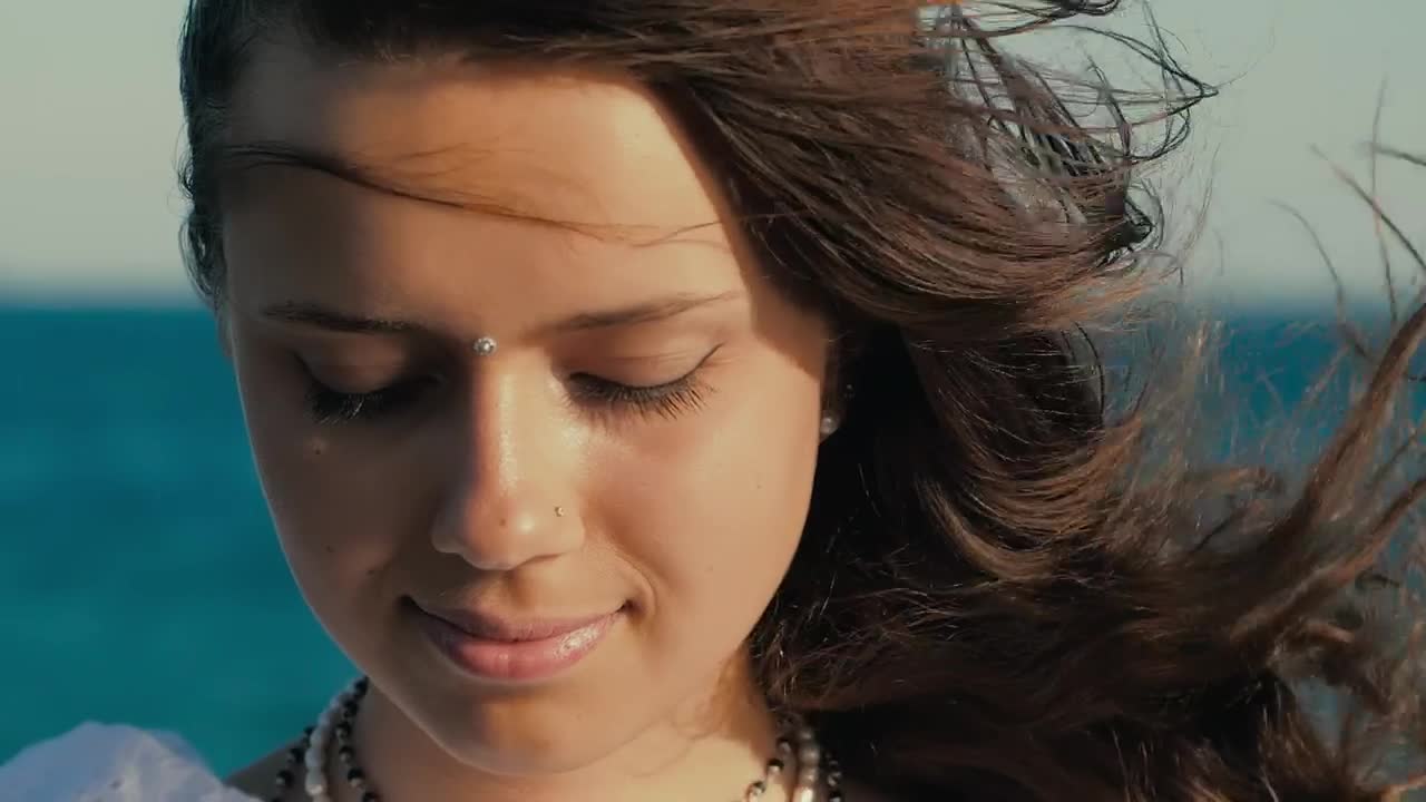 Stock Video Face Of A Cheerful Girl With Watching Near The Sea Live Wallpaper For PC