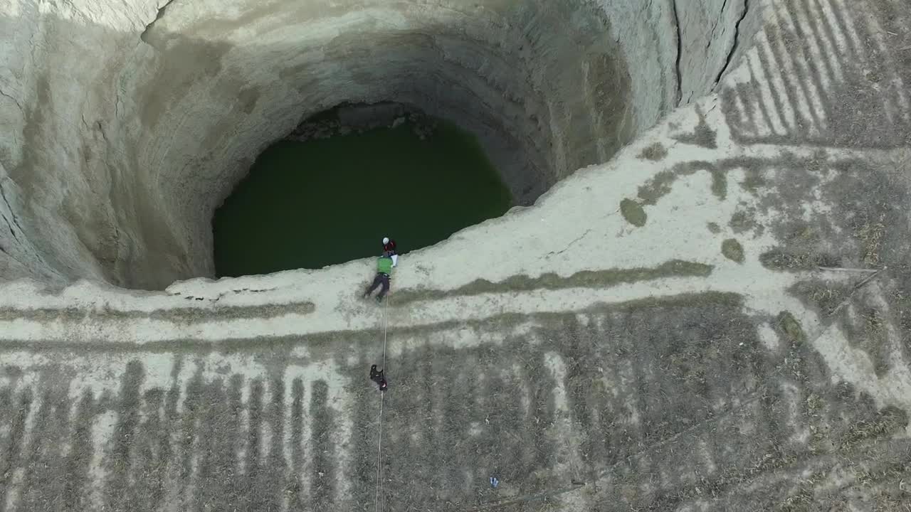 Stock Video Explorer Descending In A Deep Sinkhole Live Wallpaper For PC