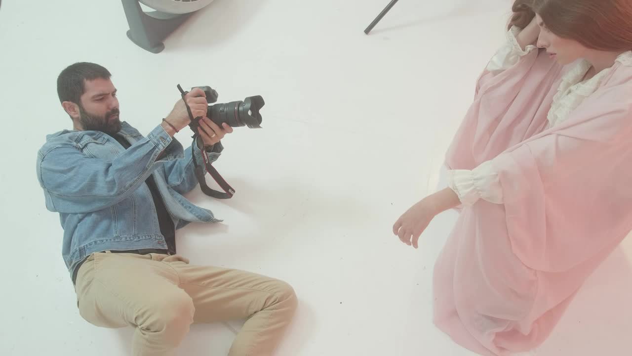 Stock Video Experienced Photographer Portraying A Girl On Set Live Wallpaper For PC