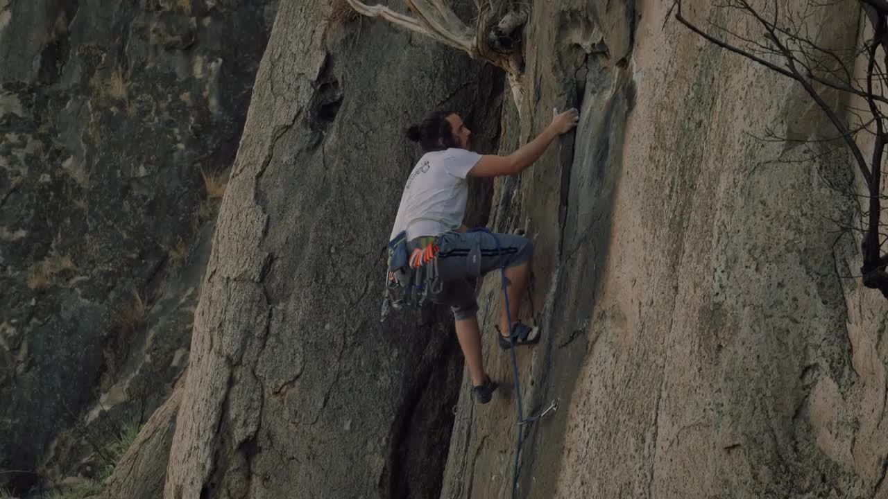 Stock Video Experienced Mountaineer Climbing A Rocky Mountain Live Wallpaper For PC