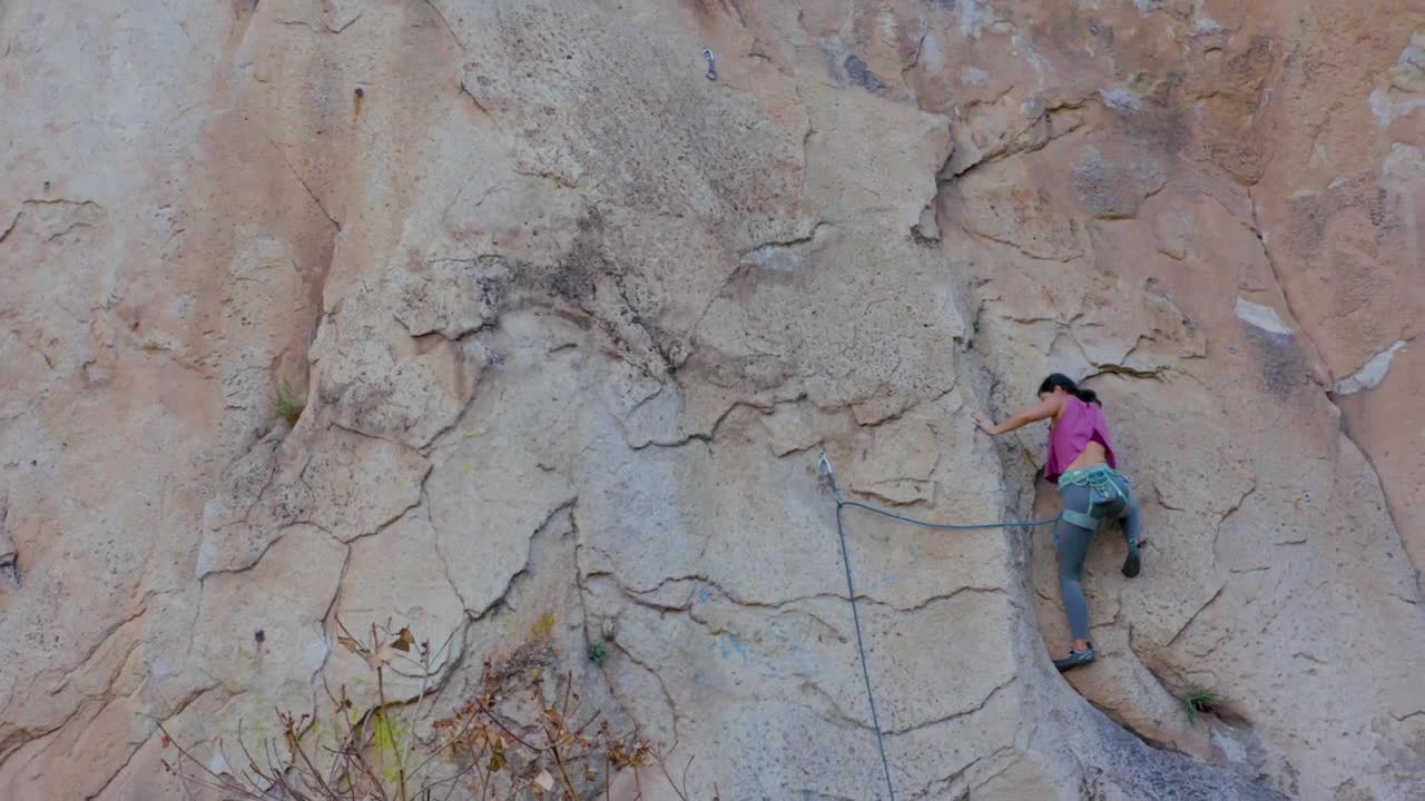 Stock Video Experienced Female Mountaineer Climbing A Vertical Mountain Live Wallpaper For PC