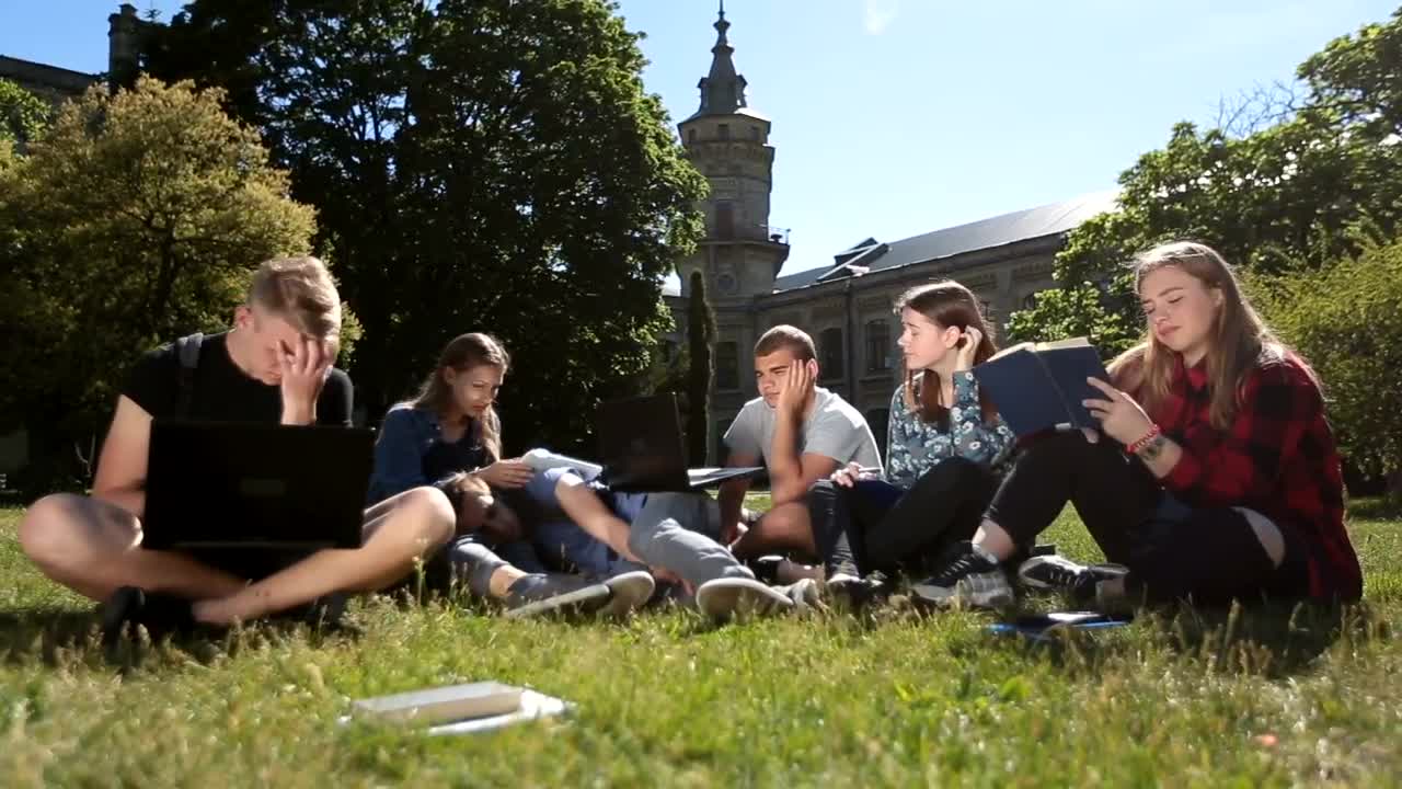 Stock Video Exhausted Classmates Studying In A School Garden Live Wallpaper For PC