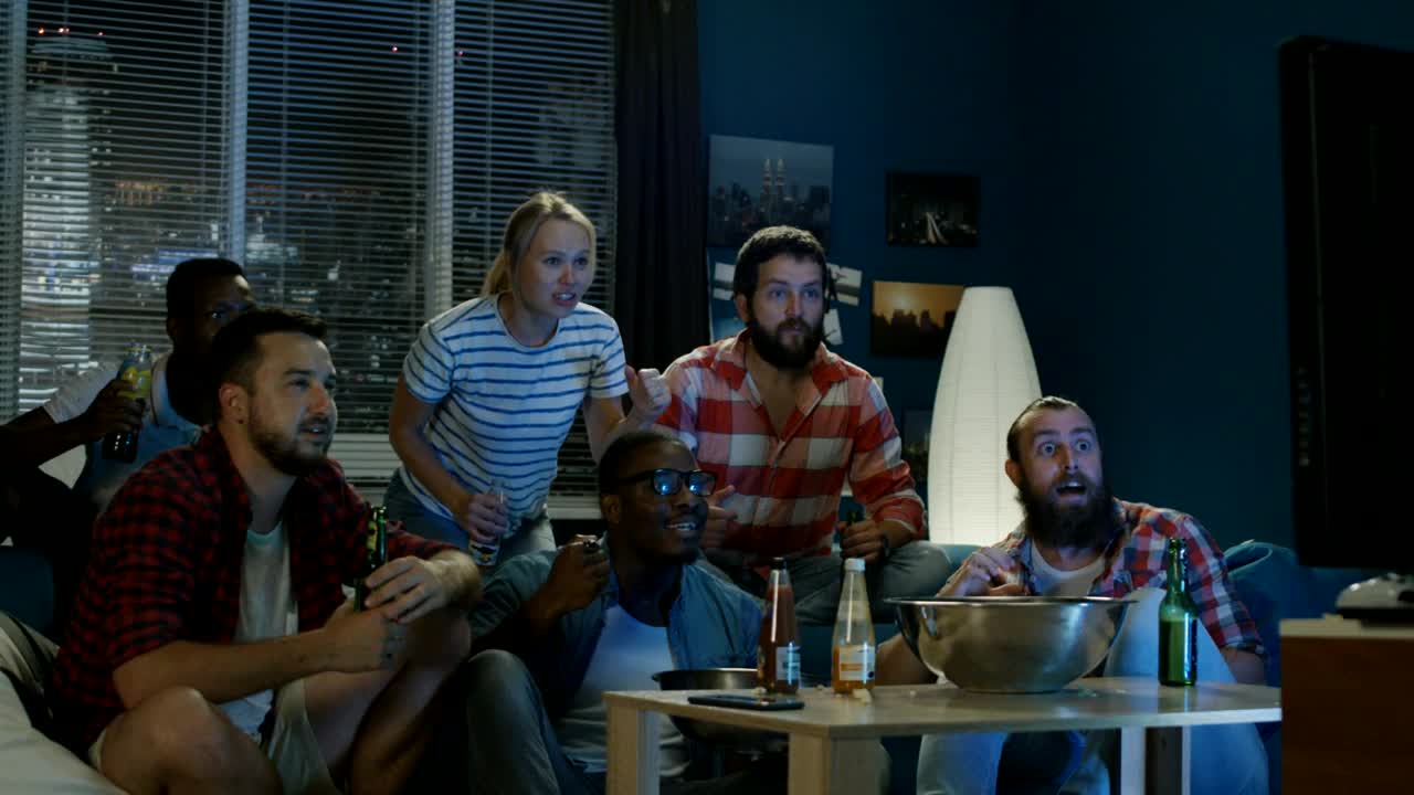 Stock Video Exciting Fans Cheering For Sports On The Tv Live Wallpaper For PC