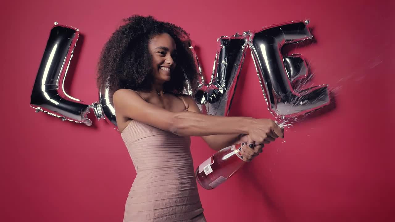 Stock Video Excited Woman With A Frothy Bottle Of Cider On Valentines Live Wallpaper For PC