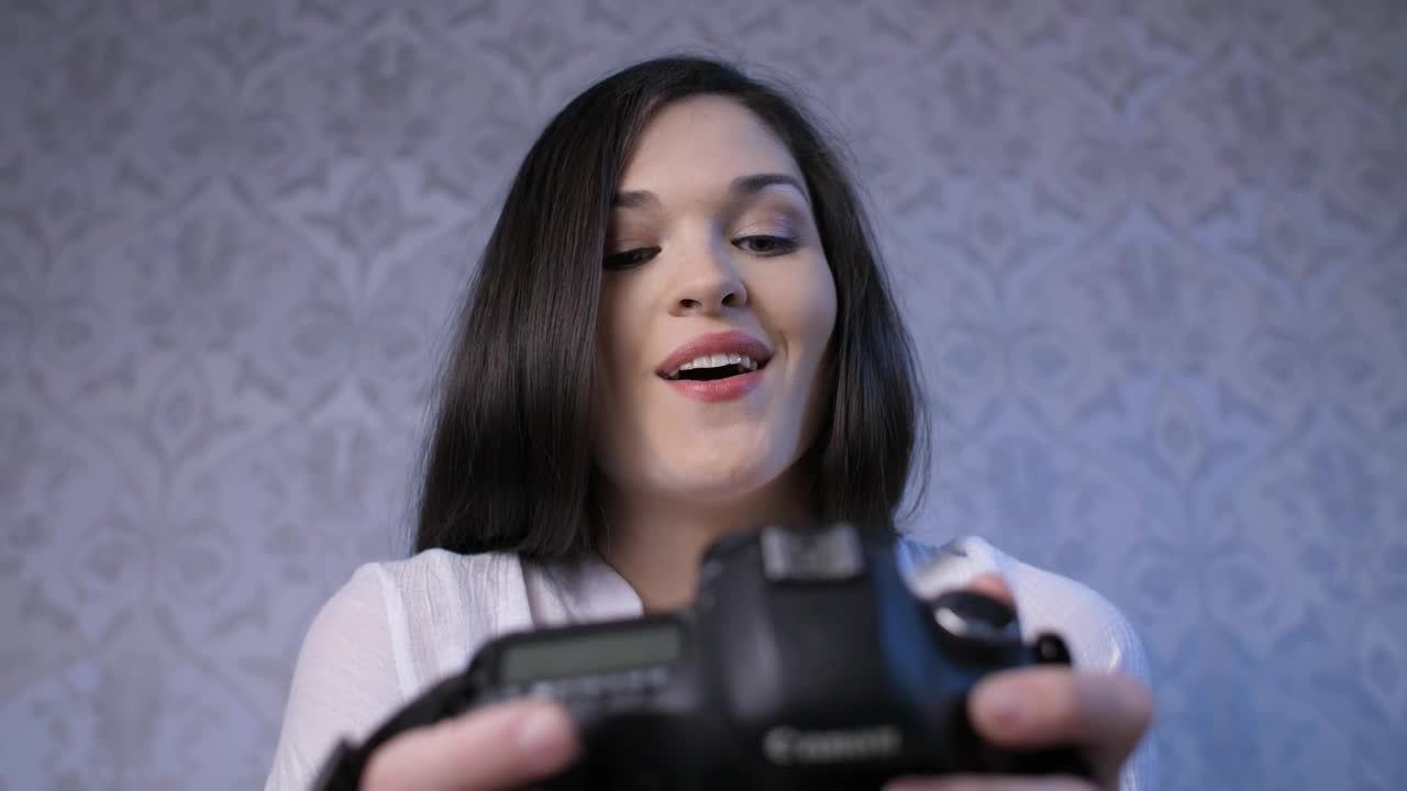 Stock Video Excited Woman Looking At Photos On Camera Live Wallpaper For PC