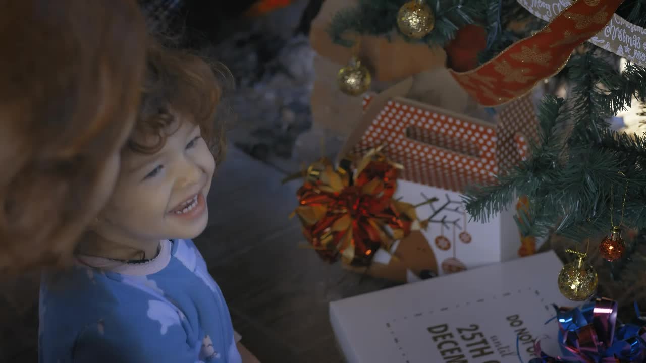 Stock Video Excited Girl Opening Gifts On Christmas Morning Live Wallpaper For PC