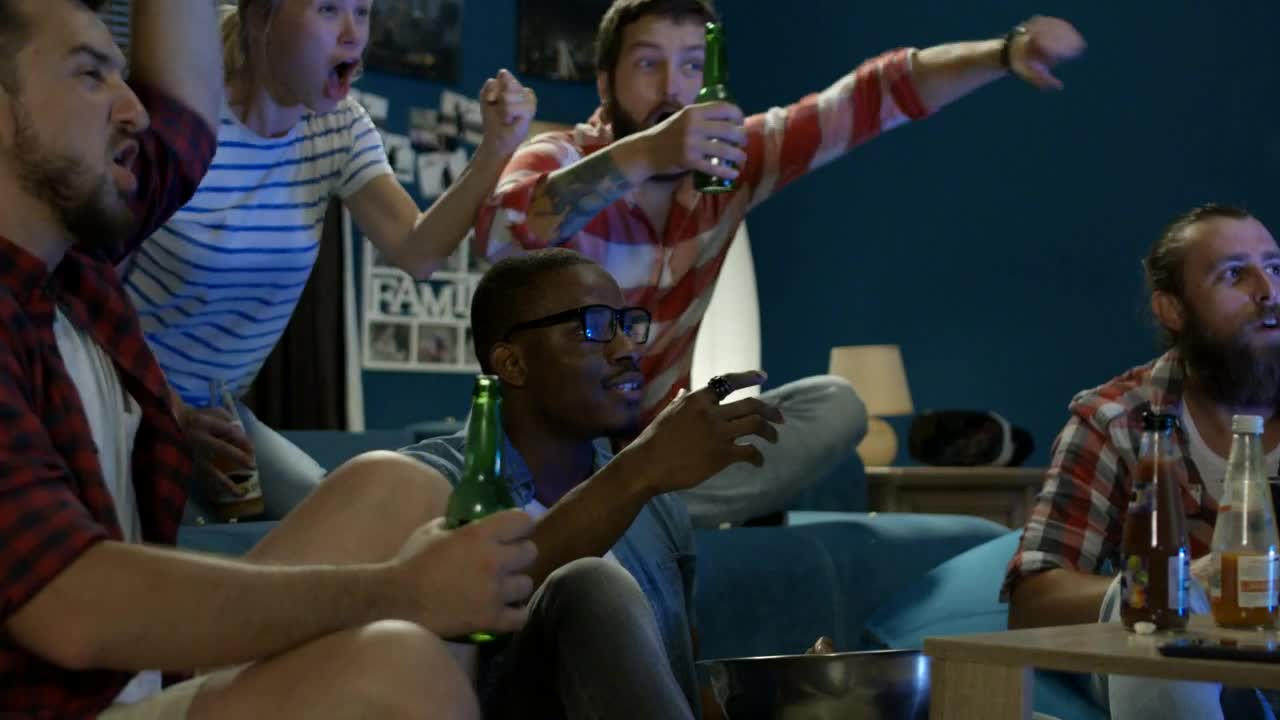 Stock Video Excited Friends Cheering At The Tv Live Wallpaper For PC