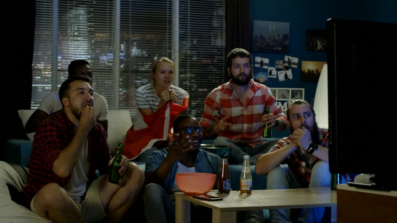 Stock Video Excited Friends Celebrating In Front Of The Tv Live Wallpaper For PC