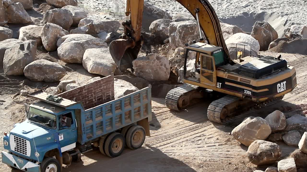 Stock Video Excavation Crane Lifts A Rock Into A Truck Live Wallpaper For PC