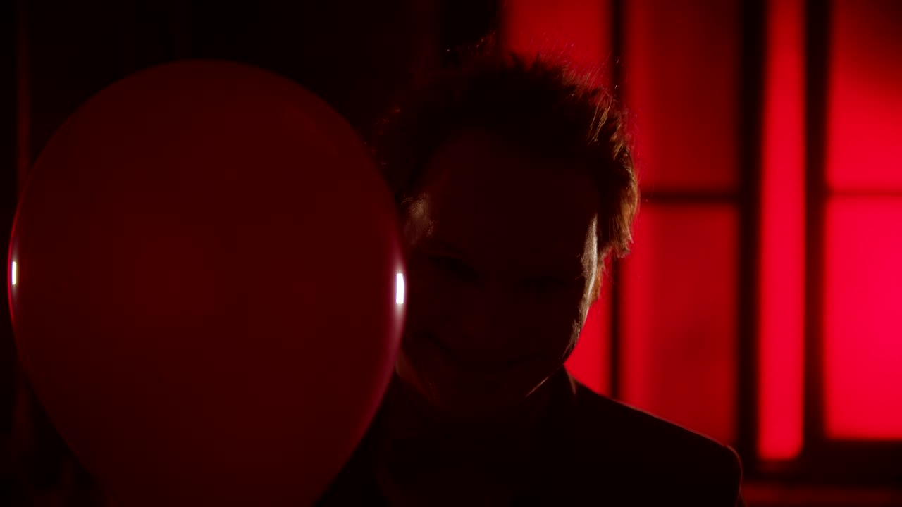 Stock Video Evil Clown Smiling Behing A Red Balloon Live Wallpaper For PC