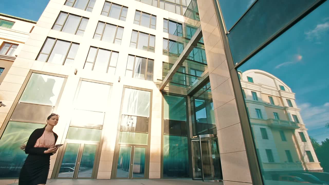 Stock Video Entrepreneur Works On Her Tablet Outside Her Office Live Wallpaper For PC