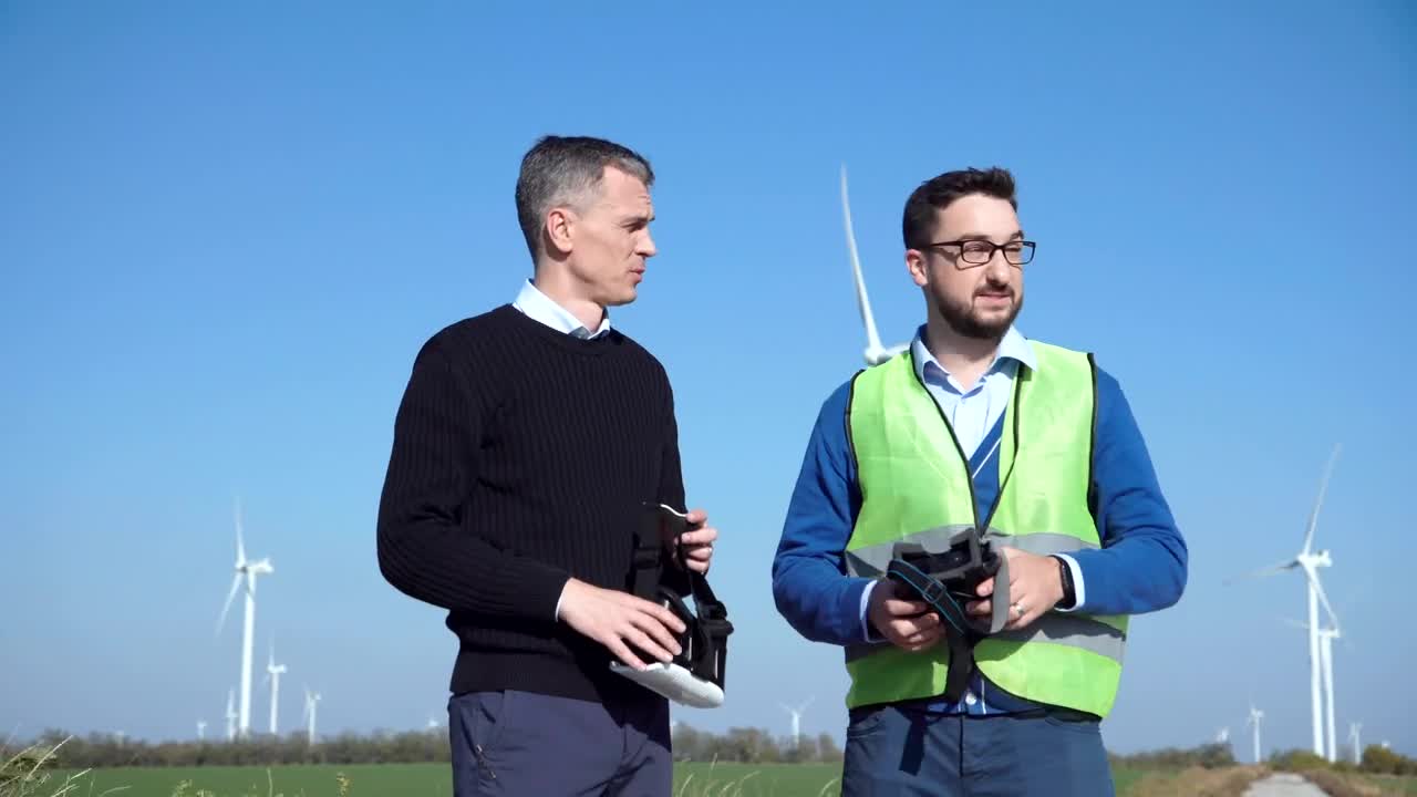 Stock Video Engineers Using Vr Headsets On Wind Farm Live Wallpaper For PC