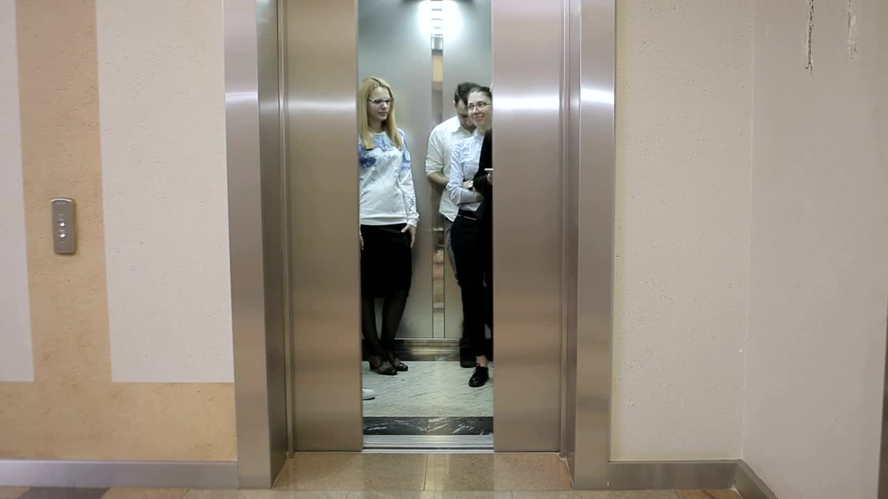 Stock Video Elevator Opens To Reveal Young Business People Live Wallpaper For PC