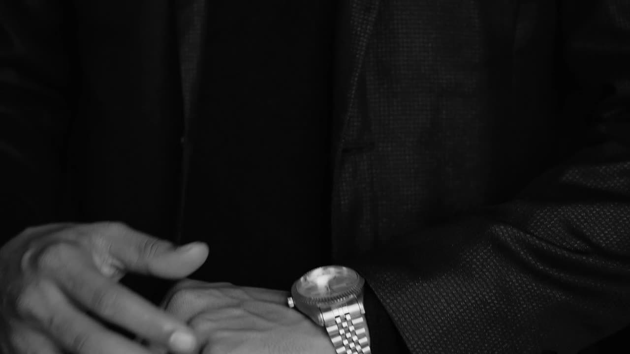 Stock Video Elegant Man In Suit Checks The Time On His Luxurious Live Wallpaper For PC