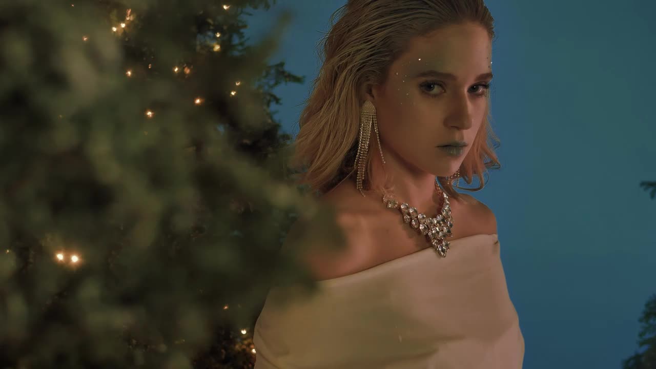 Stock Video Elegant And Captivating Girl Among Christmas Trees Live Wallpaper For PC