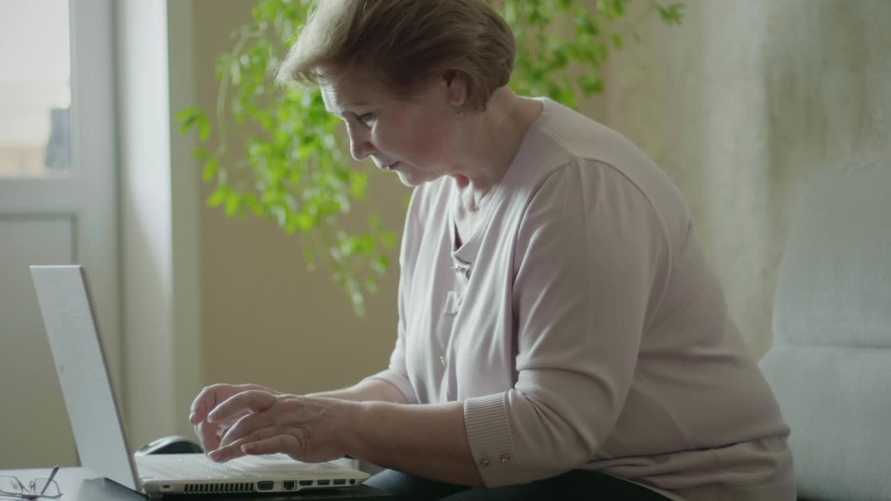 Stock Video Elderly Woman Working From Home Live Wallpaper For PC