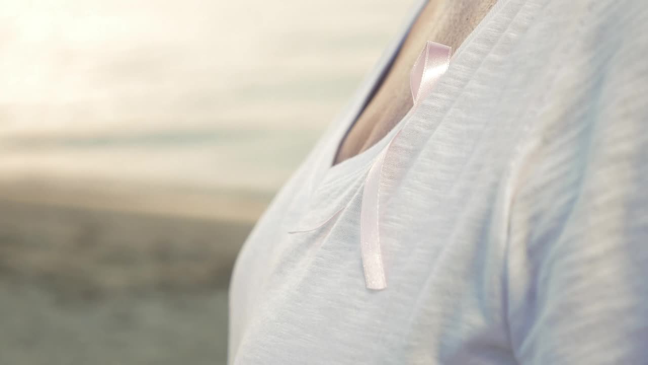 Stock Video Elderly Woman With A Pink Ribbon Live Wallpaper For PC