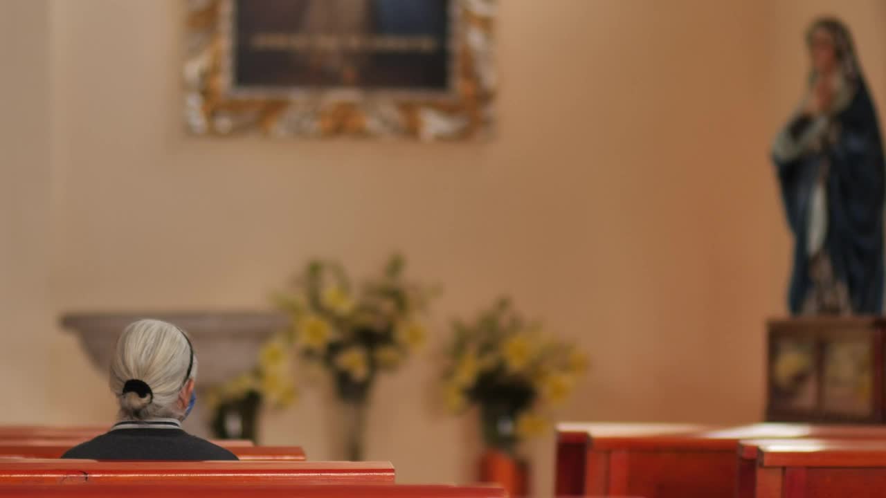 Stock Video Elderly Woman Sitting On A Pew In A Church Live Wallpaper For PC