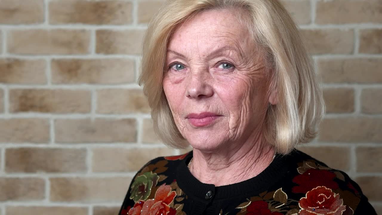 Stock Video Elderly Woman Looking Straight Into The Camera Live Wallpaper For PC