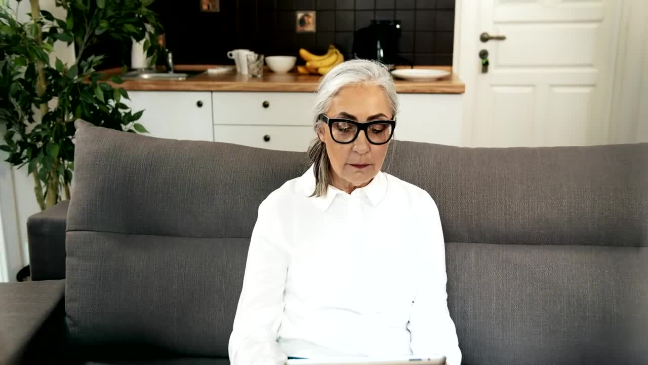 Stock Video Elderly Woman Hugging Family On Couch With Tablet Live Wallpaper For PC