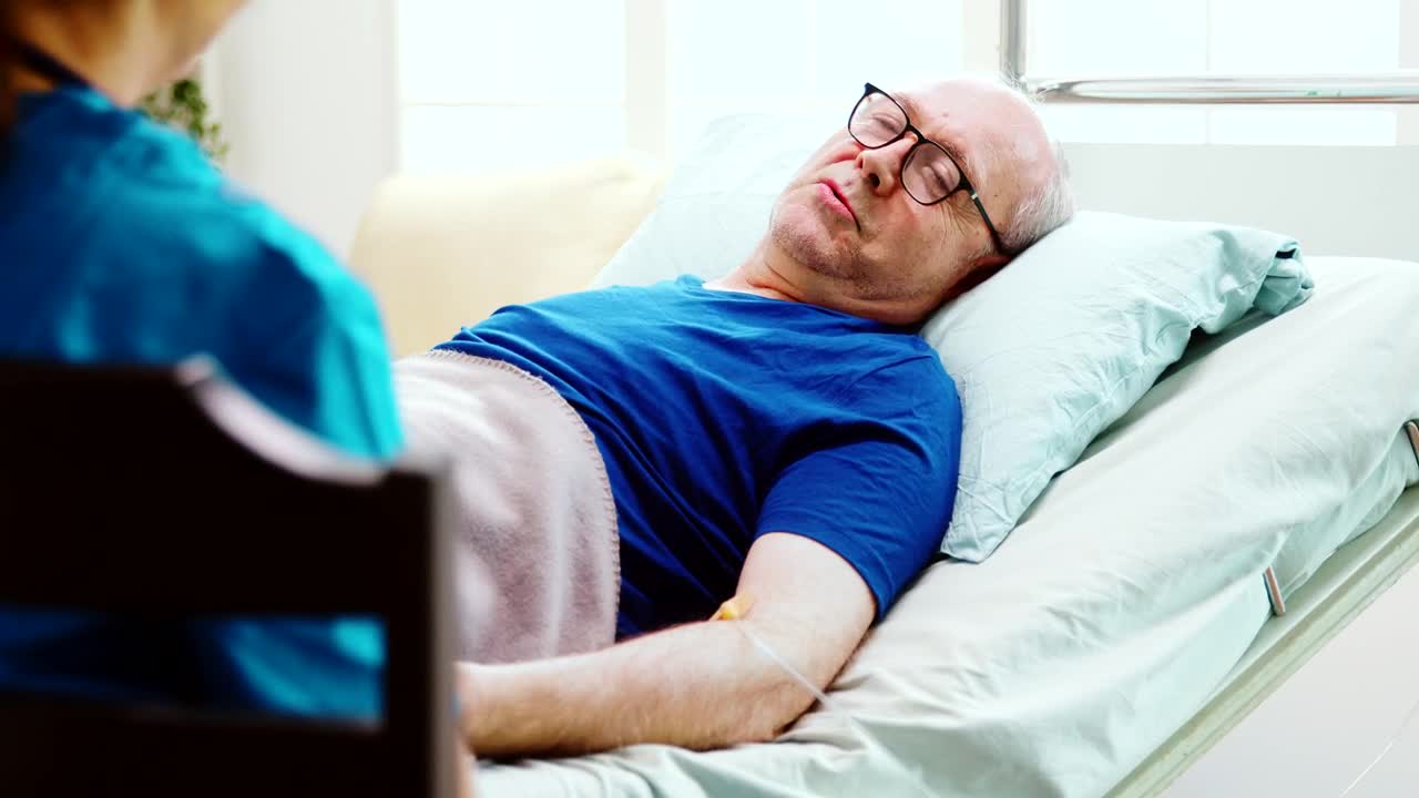 Stock Video Elderly Man Chats With Home Care Nurse While Laying In Live Wallpaper For PC