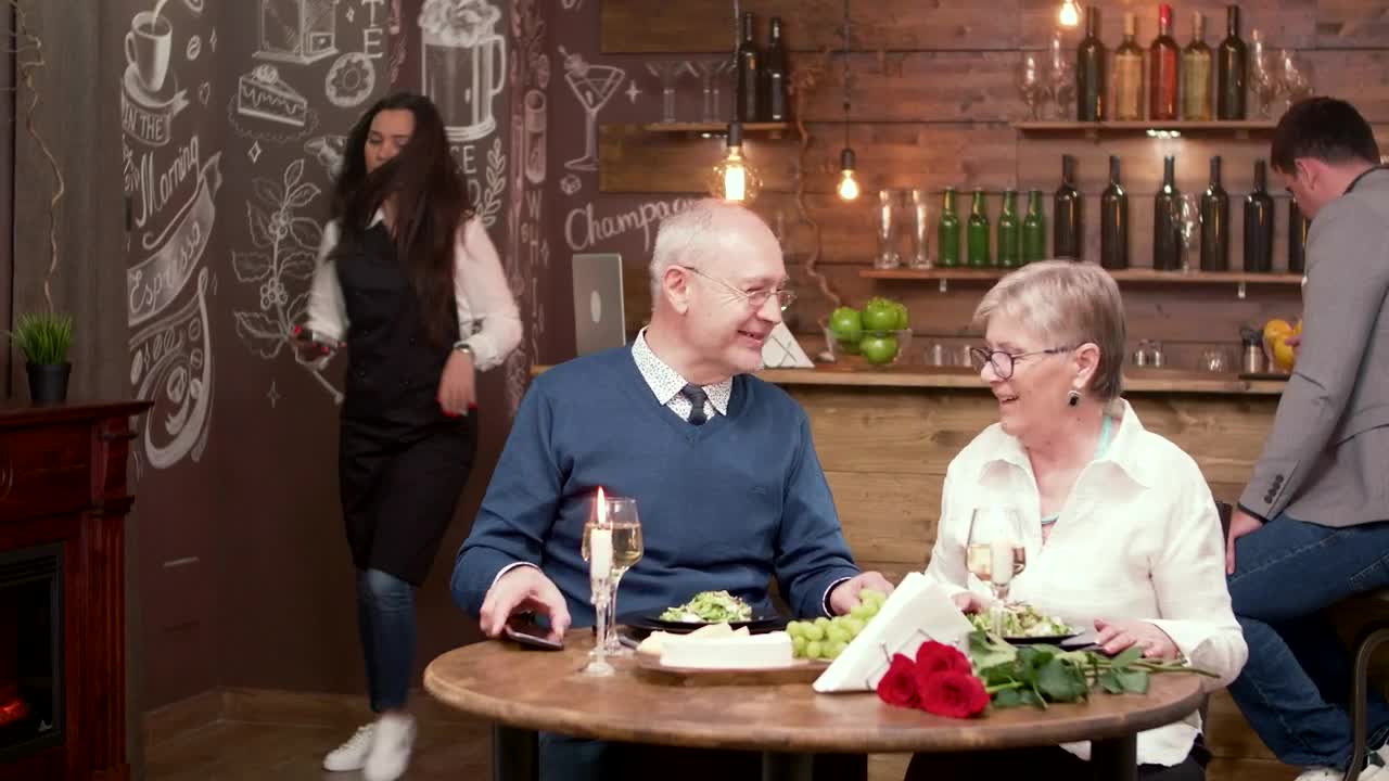 Stock Video Elderly Couple Pay For Dinner With Mobile Phone Live Wallpaper For PC