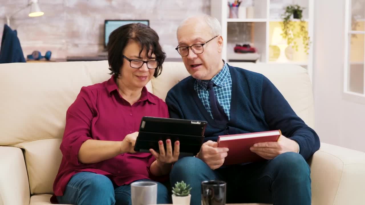 Stock Video Elderly Couple Enjoying Video Call On Sofa With Tablet Live Wallpaper For PC