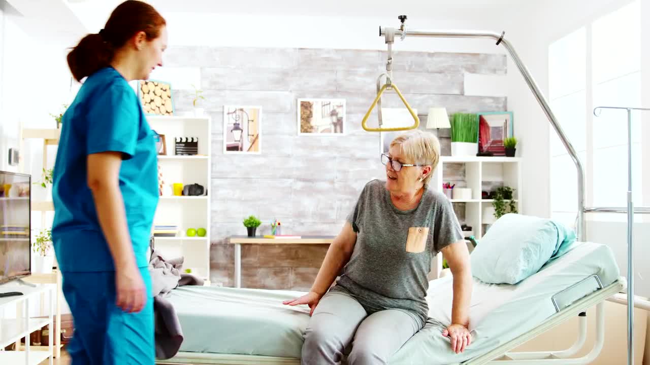 Stock Video Elder Care Nurse Helps Woman To Bed Live Wallpaper For PC