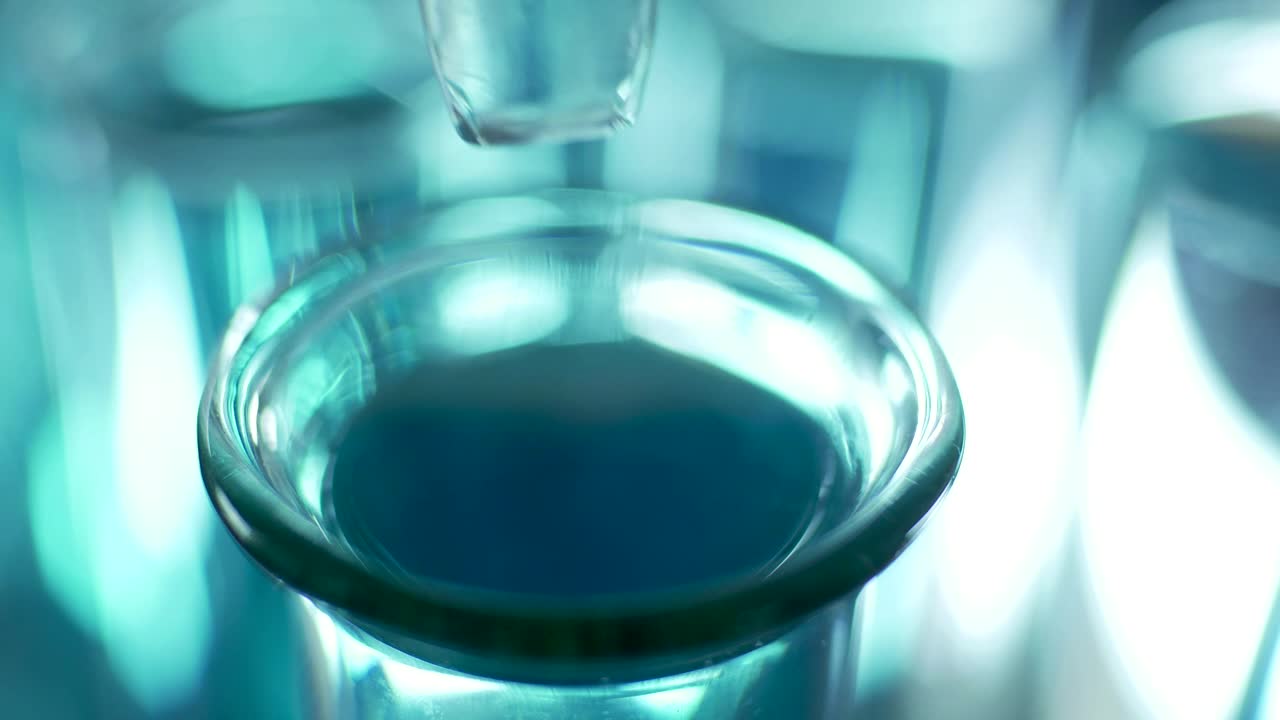 Stock Video Dropping Liquid Into A Lab Tube Close Up Live Wallpaper For PC