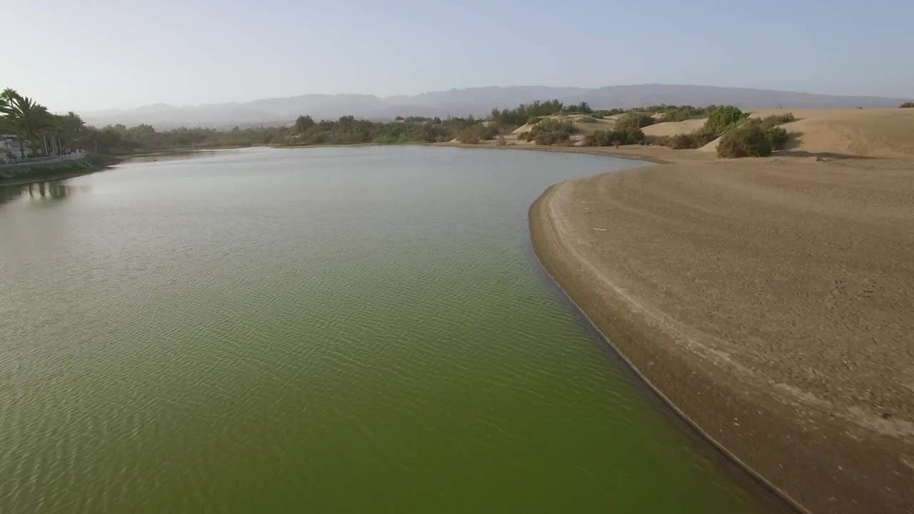 Stock Video Drone Heading Over A Green Lake Live Wallpaper For PC